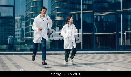 in full growth. medical professionals running to the rescue. Stock Photo