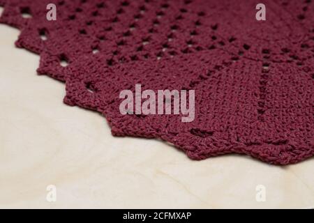 Red crochet rug handmade in close up Stock Photo