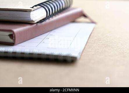 Notebooks and calendar on table. Selective focus. Copy space. Stock Photo