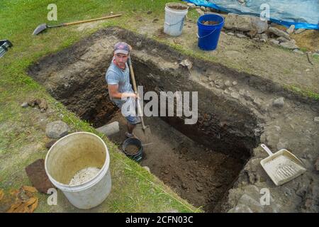 HAZLETON, PA - JUNE 30:  Justin Uehlein works at the site of an archaeologic dig June 30, 2014 in Hazleton, Pennsylvania. The team is looking through Stock Photo