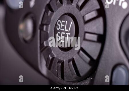 Physical selection button on a flash for professional cameras Stock Photo