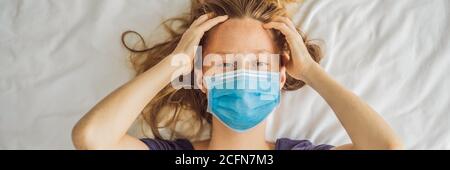 BANNER, LONG FORMAT Extremly tired young woman lying on the bed, home alone. self-isolation at home, quarantine due to pandemic COVID 19. Mental Stock Photo