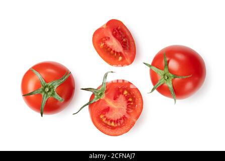 Tomatoes placed on white background and cut tomatoes shot from above Stock Photo
