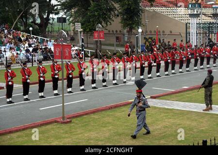 Punjab Rangers and soldiers in black uniform take a part of flag-lowering ceremony on the eve of Defense and Martyrs Day at the Joint Check Post (JCP) Wagah border in Lahore. Since the Partition of British India in 1947, Pakistan and India remained in contention over several issues. Although the Kashmir conflict was the predominant issue dividing the nations, other border disputes also existed, most notably over the Rann of Kutch, a barren region in the Indian state of Gujarat. The issue first arose in 1956 which ended with India regaining control over the disputed area. (Photo by Rana Sajid Stock Photo