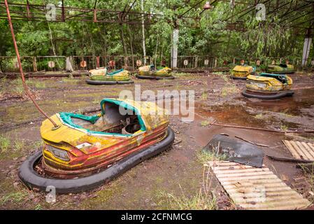 Pripyat / Ukraine - May 15, 2018: rusty bumper cars at old fair in Pripyat, Ukraine Stock Photo