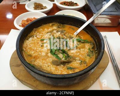 Korean style eel soup. A kind of Gukbap, which is made by putting cooked rice into a hot soup. Gochujang, chili pepper paste makes it spicy. Stock Photo