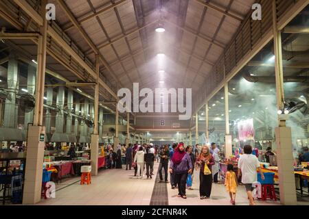 Bandar Seri Begawan / Brunei - January 16, 2019: crowd of people looking for food at Gadong Night Market with smoky ambience Stock Photo