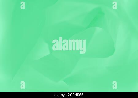Soft light green flowing fabric, beautiful green color background Stock Photo