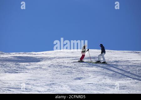 Two skiers enjoy the view Stock Photo