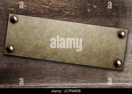 Horizontal background with metallic plate with vintage rivets on wood board. Mock up template. Copy space for text. Can be used for steampunk and grun Stock Photo