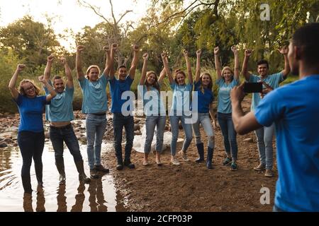 Man taking photos of happy multi ethnic group Stock Photo