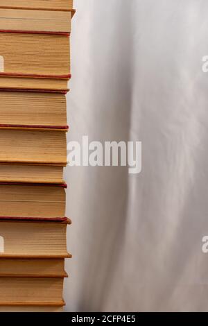 Background with piled up old books Stock Photo