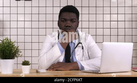 African American doctor looking serious to camera thinking. Stock Photo