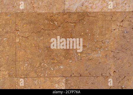 Old weathered brown wall tile with cracks in high resolution close up Stock Photo