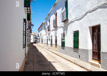 Old white houses with balconies in a street of Almagro, Spain, province of Ciudad Real Stock Photo