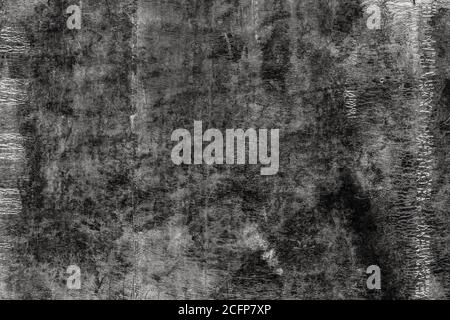Black texture of old roofing material. Weathered mottled shabby building material with cracks. Dark abstract background Stock Photo