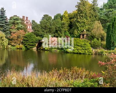 Autumn colours in the grounds of Sandringham House, with the House in the background, Norfolk, UK