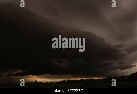 Panorama scenic cloudscape of Dark sky and black clouds, dramatic storm clouds before rainy. Stock Photo