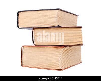 Three closed old thick paper books with yellow pages white background isolated closeup, book heap, pile, stack, vintage hardcover textbooks, education Stock Photo