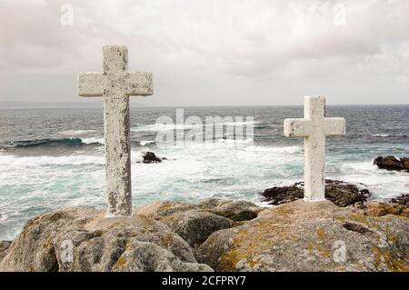 Two stone crosses in the coastal region of Galicia (Spain) called Costa de la Muerte. It is located  between Cape Finisterre and Malpica de Bergantiño Stock Photo