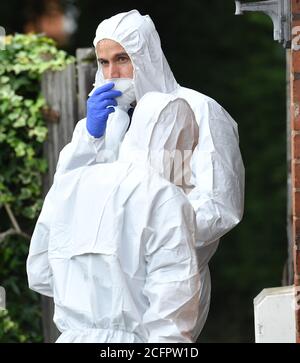 Forensic investigators outside a property on Nately Grove, Selly Oak, Birmingham. West Midlands Police arrested 27-year-old man this morning in the Selly Oak area on suspicion of murder and seven counts of attempted murder following a series of stabbings in the city centre of Birmingham in the early hours of Sunday. Stock Photo