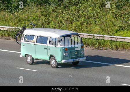 2014 white green VW Volkswagen Caravans and Motorhomes, campervans on Britain's roads, RV leisure vehicle, family holidays, caravanette vacations, Touring caravan holiday, van conversions, Vanagon autohome, life on the road, Bay Window Dormobile Stock Photo
