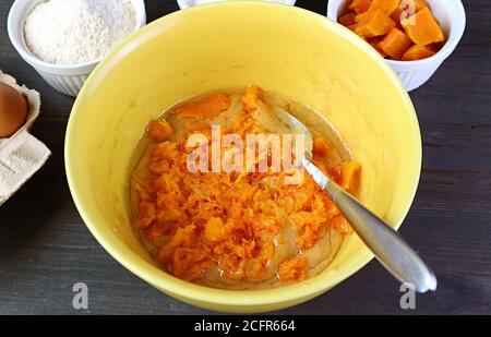Mashed butternut squash with cake batter in the mixing bowl before baking Stock Photo