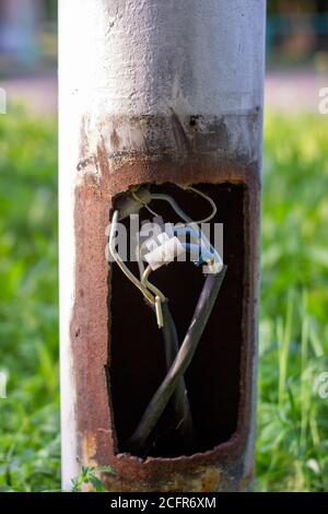 Repair of wires on the street. Connected the wires. The electrical system was broken, but it was repaired Stock Photo