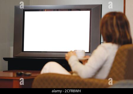 Women watching television at home on sofa Stock Photo