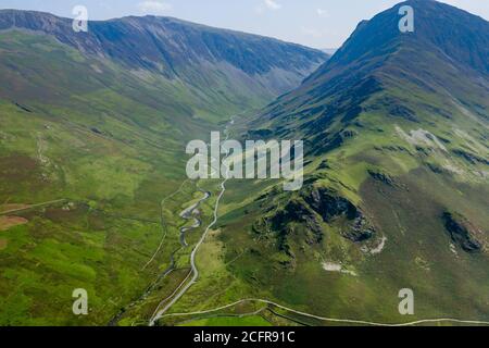 Aerial view of a road running through an impressive, narrow mountain pass (Honister Pass, Lake District, England) Stock Photo