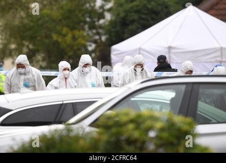 Police officers conduct a search on Friends Walk, Kesgrave, Suffolk, where a 15-year-old student from Kesgrave High School was shot just after 8.40am this morning. Suffolk Police have arrested teenage boy in connection with the incident. Stock Photo