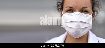 Biology and science. Doctor wearing protection face mask. Virus or bacteria cells. Global alert. Epidemic flu. Coronavirus. Medical staff preventive g Stock Photo