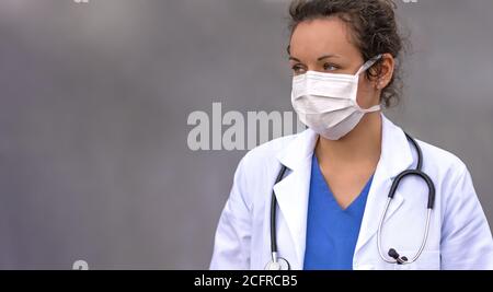 Biology and science. Doctor wearing protection face mask. Virus or bacteria cells. Global alert. Epidemic flu. Coronavirus. Medical staff preventive g Stock Photo