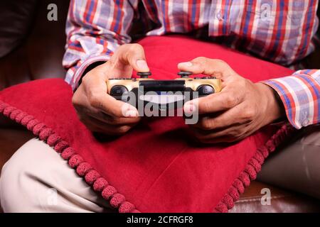 man hand hold joystick playing games . Stock Photo