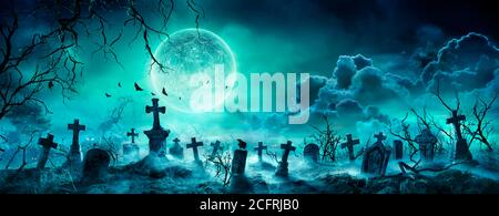 Graveyard At Night - Spooky Cemetery With Moon In Cloudy Sky And Bats