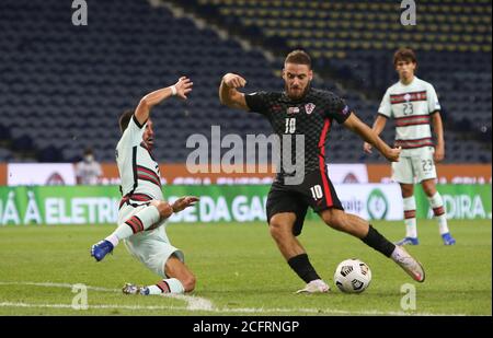 Joao Moutinho of Portugal in action with Nikola Vlasic of Croatia during the UEFA Nations League Group A3 football match between Portugal and Croatia Stock Photo