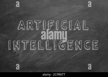 Hand drawing text Artificial intelligence on blackboard. Stock Photo