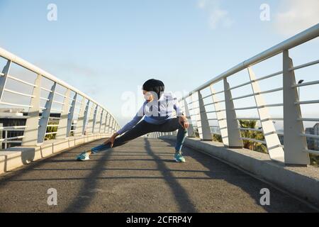 Woman exercising outdoors in the city Stock Photo