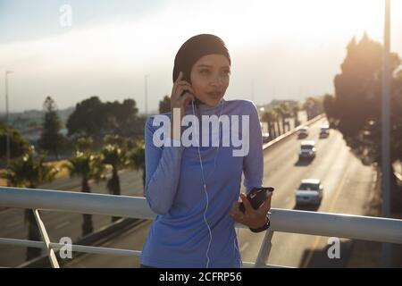 Woman exercising outdoors in the city Stock Photo