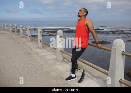 Man with prosthetic leg standing on the promenade Stock Photo