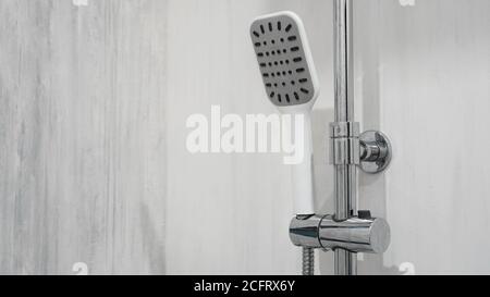 Modern shower in grey interior, bath room in resort hotel background Stock Photo