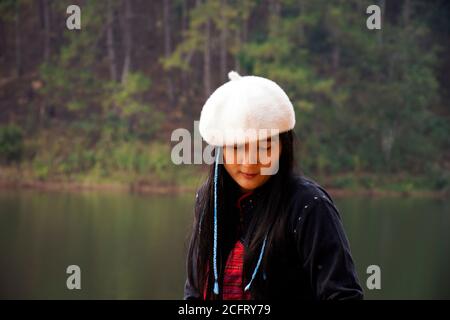 Travelers thai women journey travel visit and take photo between tour at Pang Ung lake in Pang Oung forest park or Switzerland of Thailand  in Chinese Stock Photo