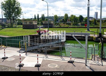 Canal lock with a closed steel gate on the Moselle river in West Germany. Stock Photo