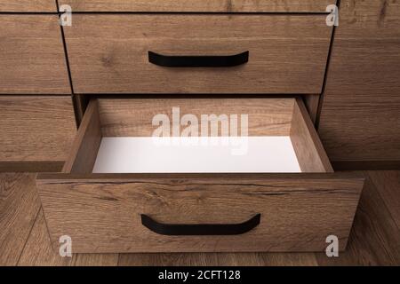 Empty open wooden drawer. Storage box. Stock Photo