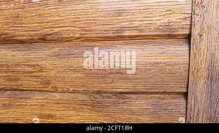 Wooden background. The brown boards are laid out in a specific order. Natural natural material. Environmental friendliness. Stock Photo