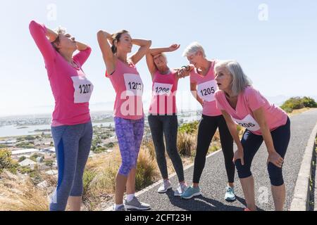 Group of woman taking a break from running Stock Photo