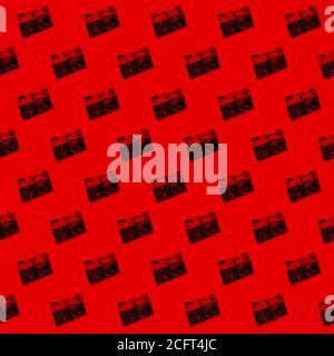 Seamless pattern of vintage photo camera red palette Stock Photo