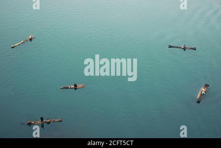 Aerial view of the Li River in Guilin, Guangxi Province, China taken from the summit of Mt Diecai. Unidentifiable fishermen float on bamboo rafts. Stock Photo