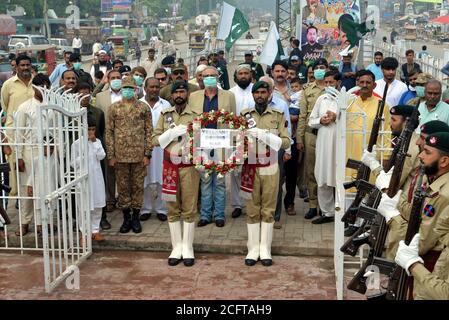 Punjab Rangers and soldiers in black uniform take a part of flag-lowering ceremony on the eve of Defense and Martyrs Day at the Joint Check Post (JCP) Wagah border in Lahore. Since the Partition of British India in 1947, Pakistan and India remained in contention over several issues. Although the Kashmir conflict was the predominant issue dividing the nations, other border disputes also existed, most notably over the Rann of Kutch, a barren region in the Indian state of Gujarat. The issue first arose in 1956 which ended with India regaining control over the disputed area. (Photo by Rana Sajid Stock Photo