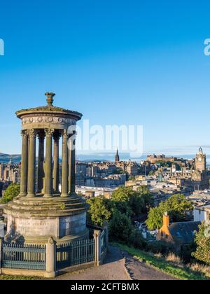 Edinburgh Landscape with, Dugald Stewart Monument, The City of Edinburgh in the Background with the Balmoral Hotel, Scotland, UK. Stock Photo